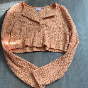 Orange cropped sweater.Never worn before!!